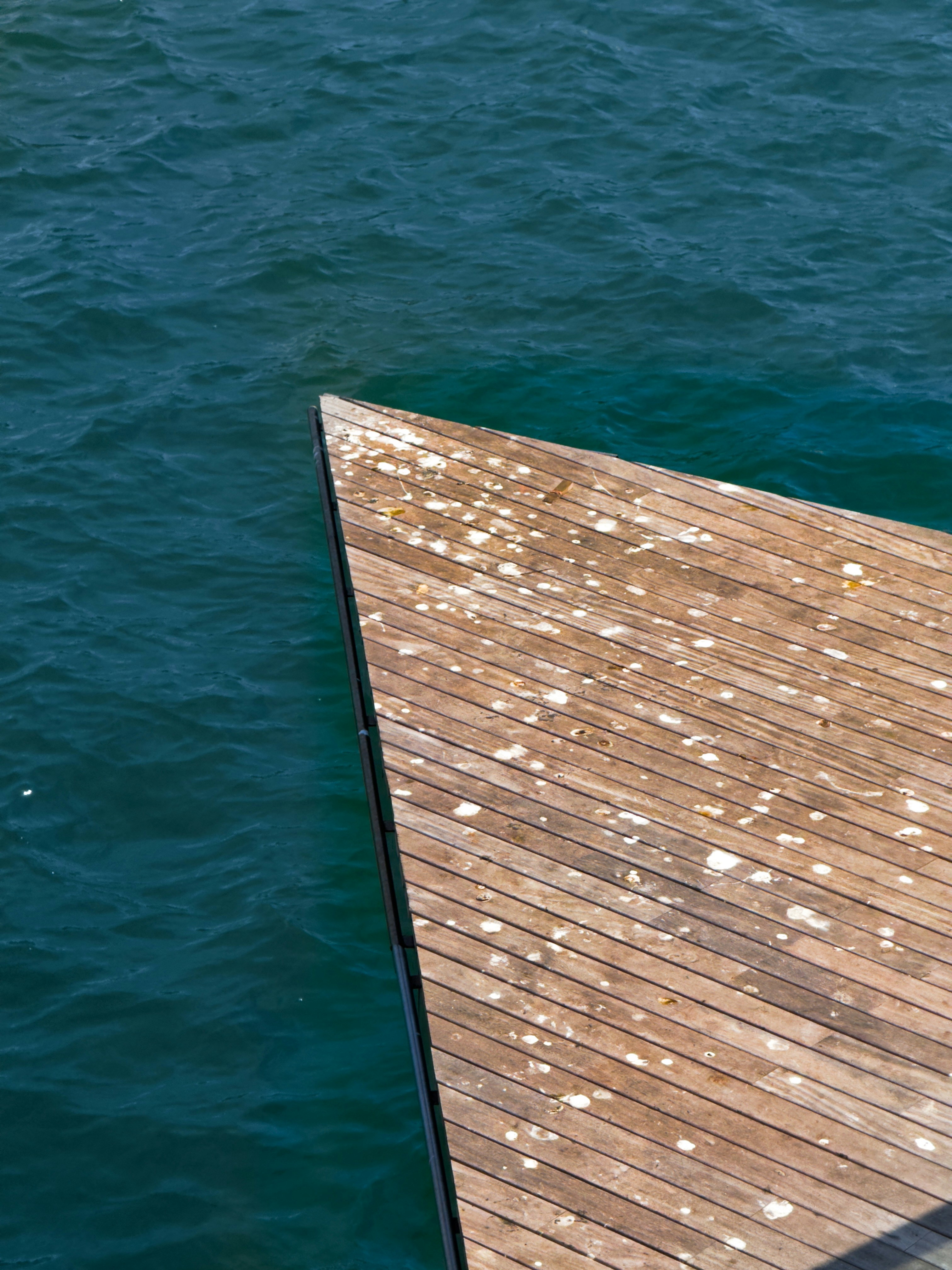 Photo of a triangle-shaped pier next to the sea
