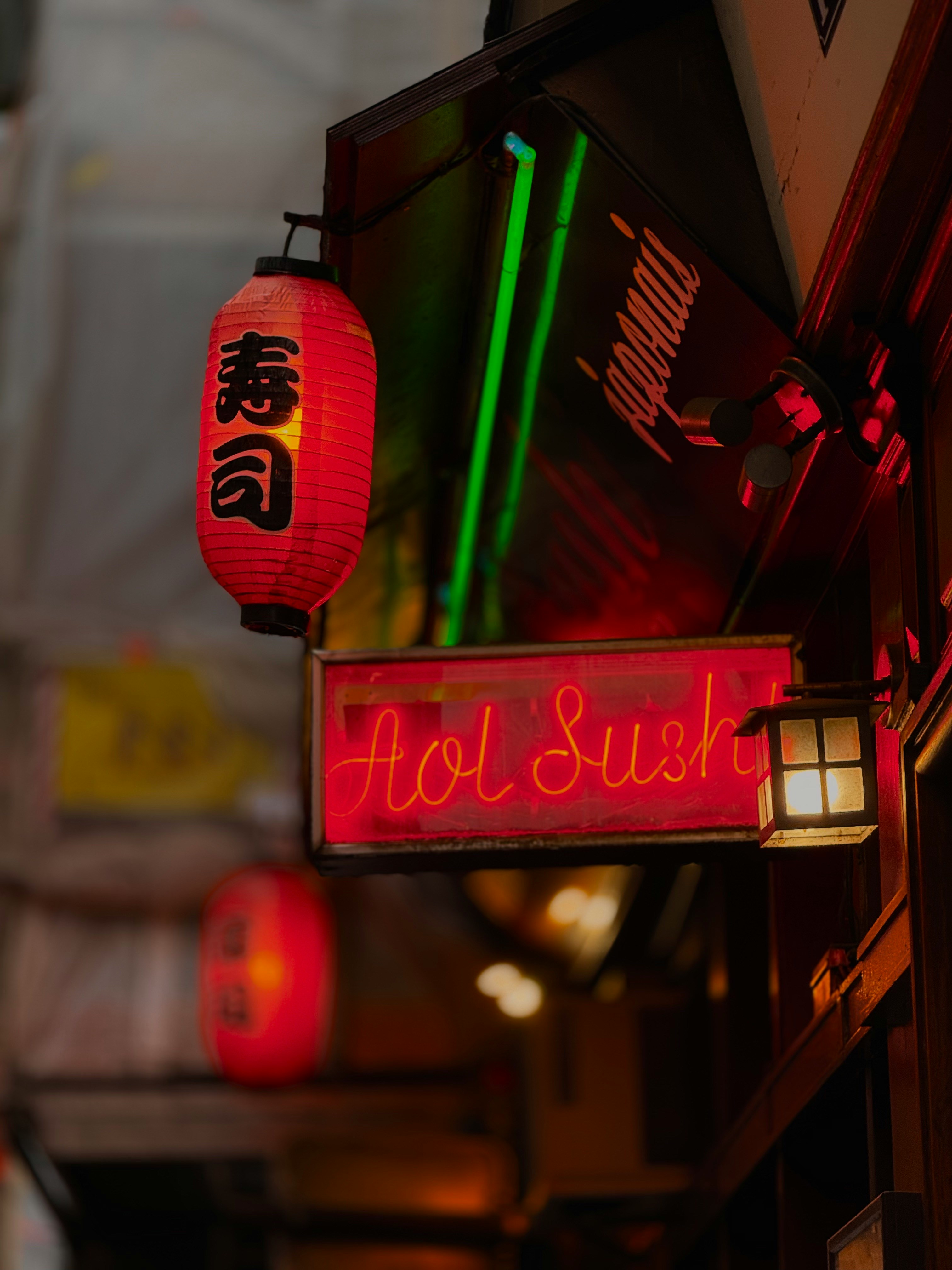Photo of the red neon sign of a sushi restaurant